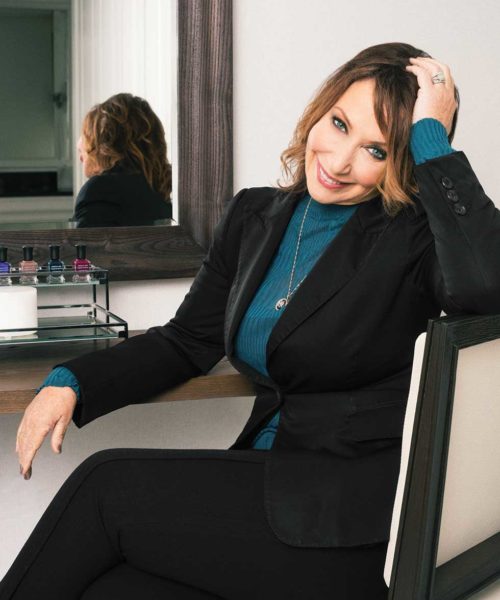 Deborah Lippmann smiling in a chair
