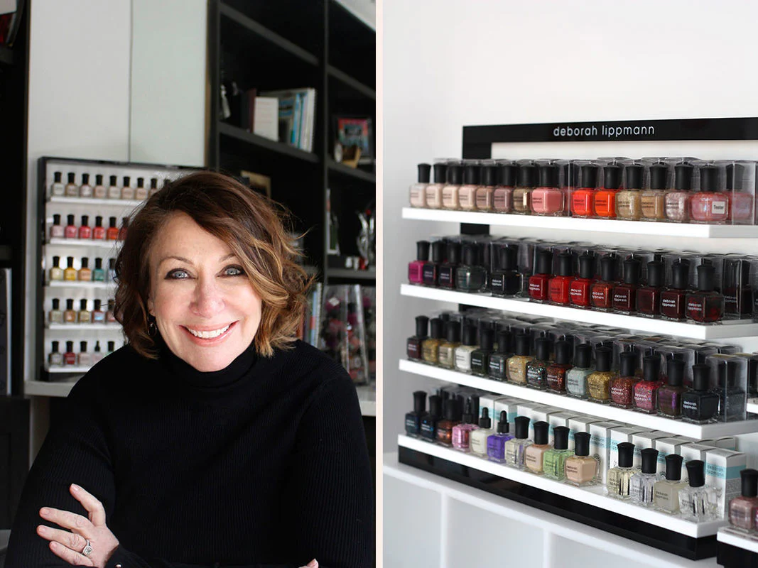 Deborah Lippmann smiling next to her nail polish products