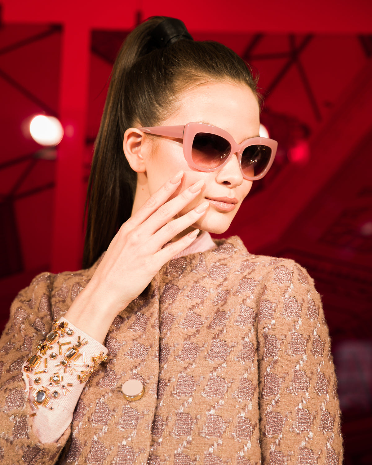 Female model holding her hand to her face with Deborah Lippmann nail polish on