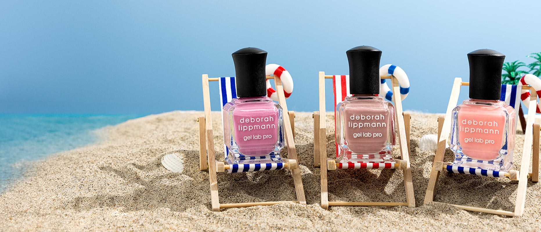 nail polish bottles sitting in beach chairs